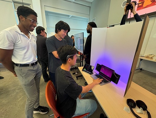 Visitors trying NeuroLight at the Jacobs Design Showcase